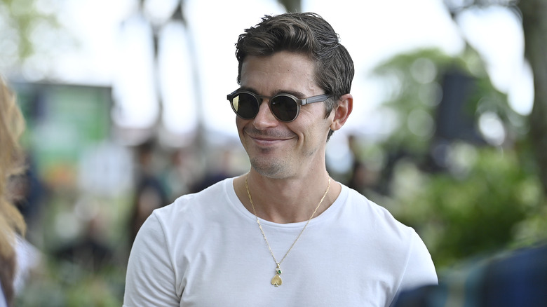 Antoni Porowski smiling wearing sunglasses