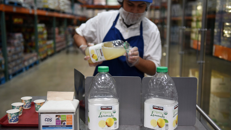 Costco worker pouring lemonade