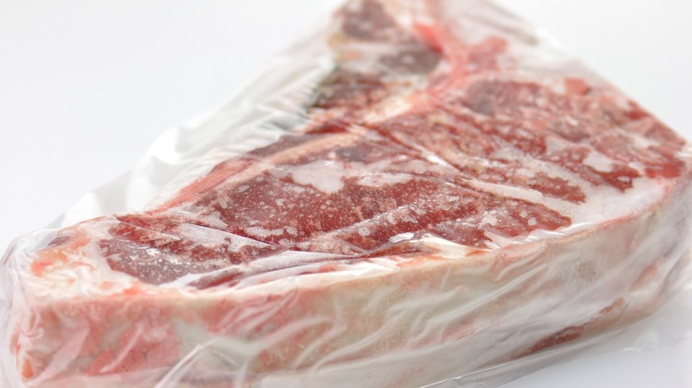 Frozen T-bone steak in plastic