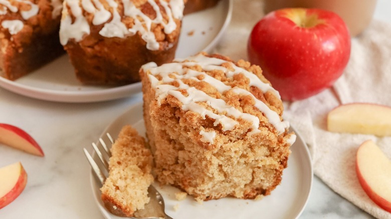 Slice of apple crumb coffee cake on plate