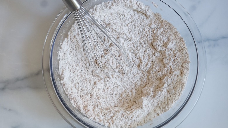 Flour mixture in bowl with whisk