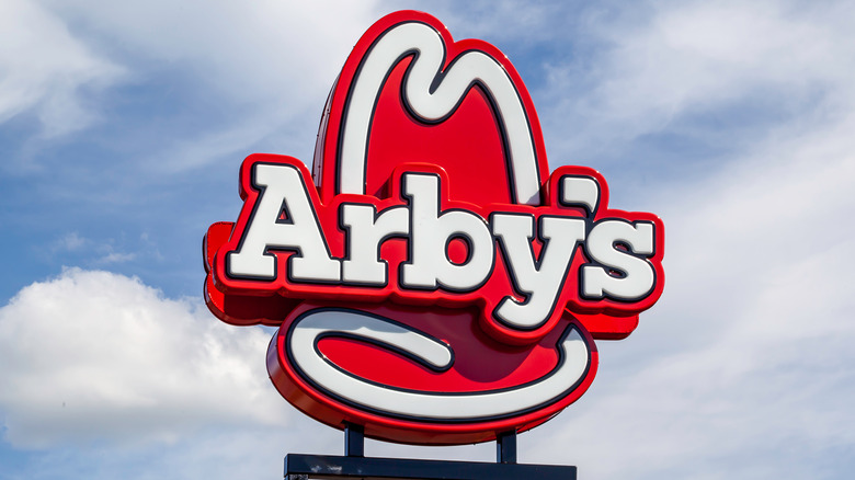 Arby's sign against blue sky