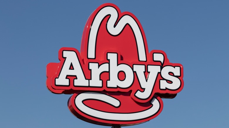 Arby's sign against a blue sky