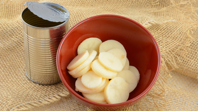 aluminum can and potatoes in bowl