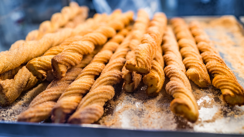 Pile of long churros on display