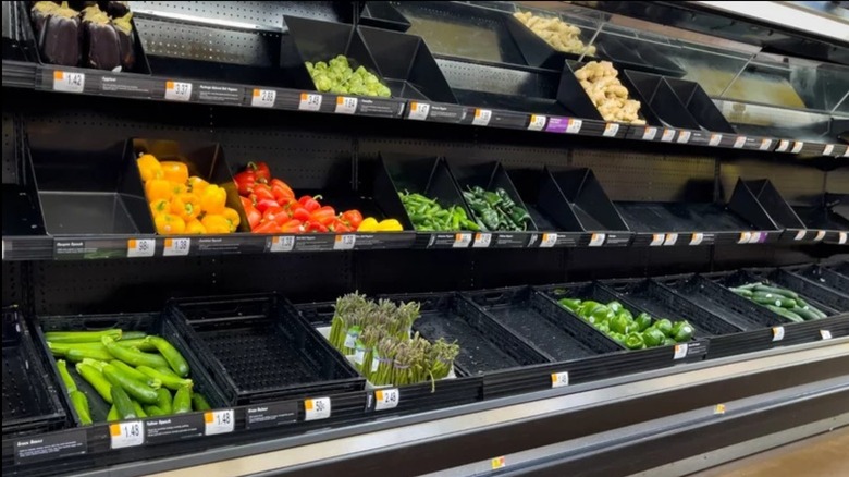 empty vegetable bins at market