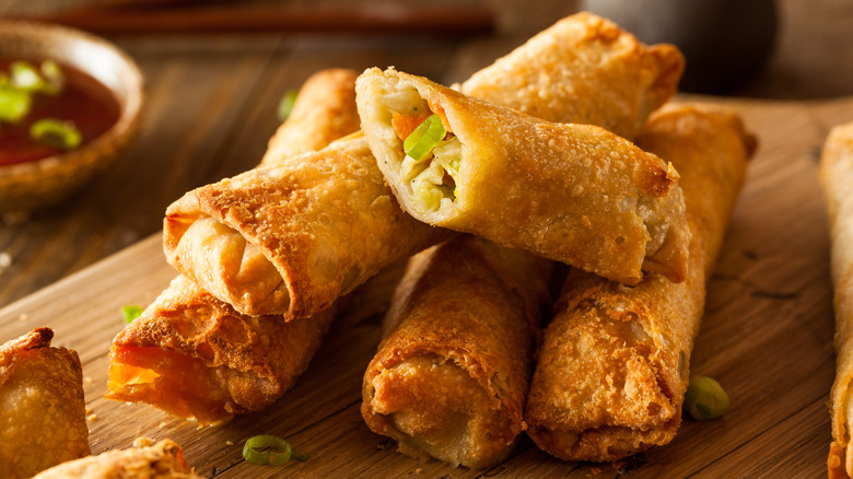 egg rolls on a wooden board