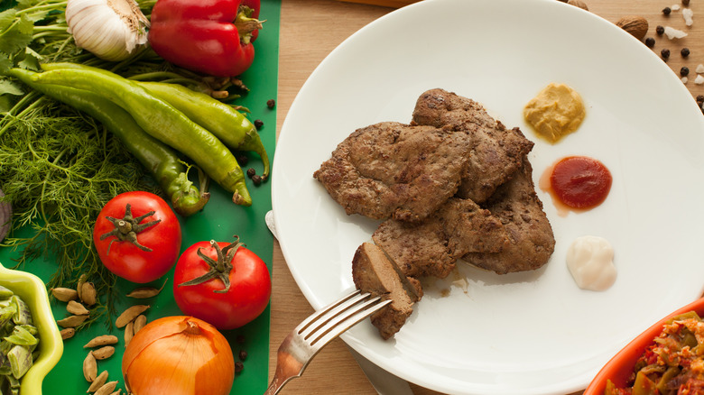 vegetables and a plate of meat