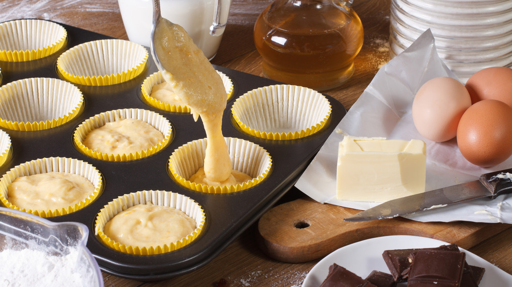 Pouring cupcake batter