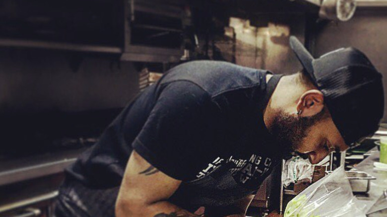 Ashish Alfred working in restaurant kitchen