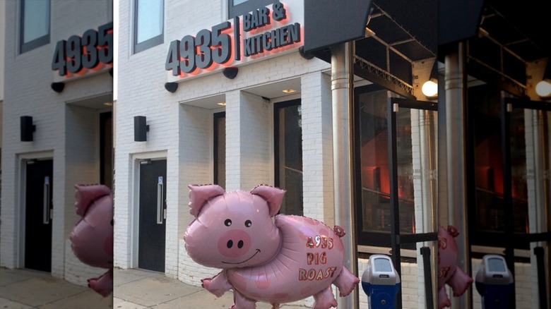Exterior of 4935 Bar and Restaurant with pig balloon