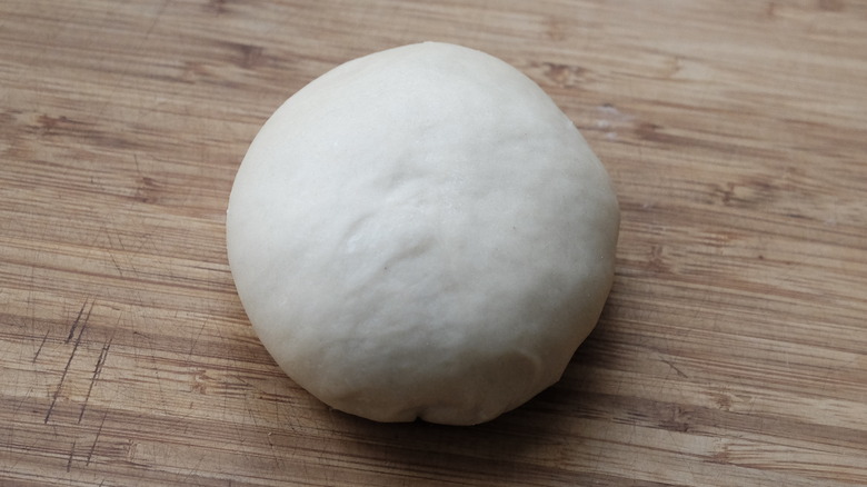 dough ball on wooden board