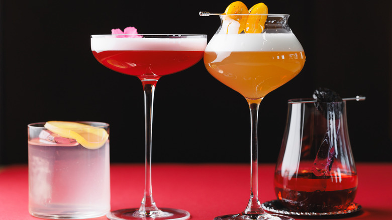 A collection of colorful cocktails in stylish glasses