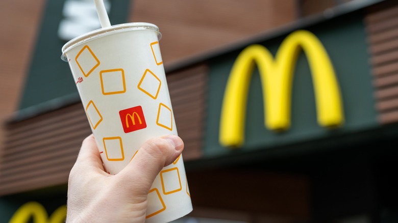 hand holding McDonald's drink