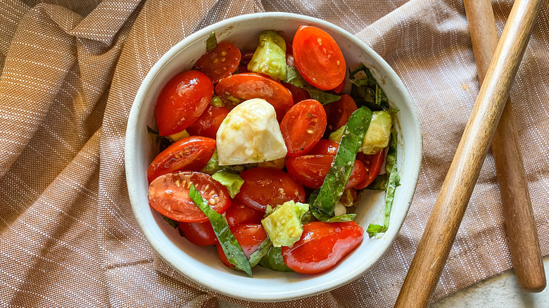 avocado caprese salad in bowl