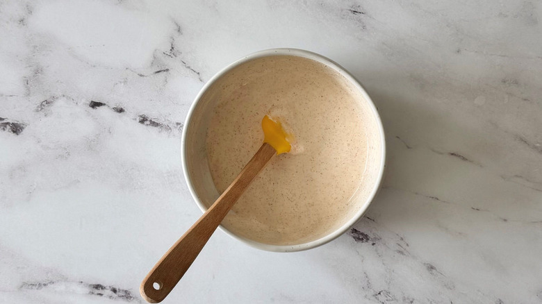 Crema in bowl with rubber spatula