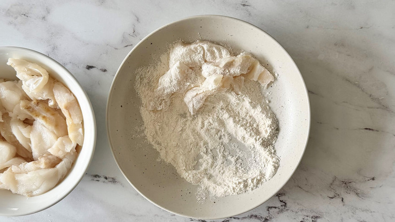 Cod pieces coated in flour bowl