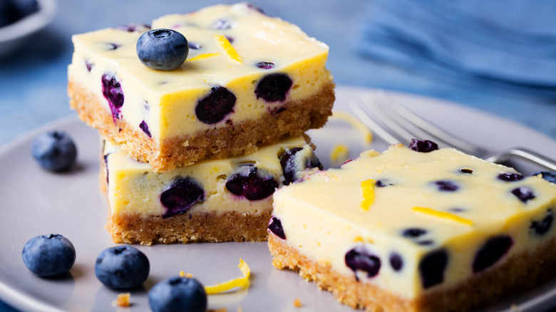 Blueberry cheesecake squares on a plate