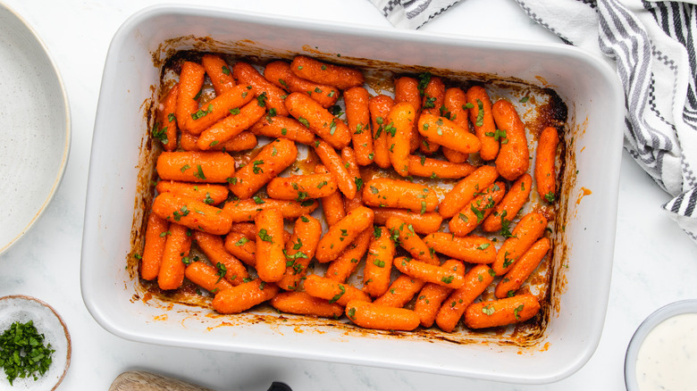 Baked baby carrots in baking dish