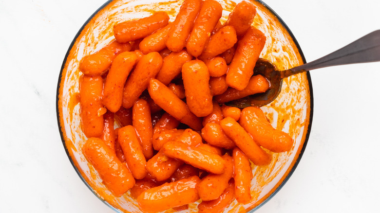 Baby carrots marinated in bowl