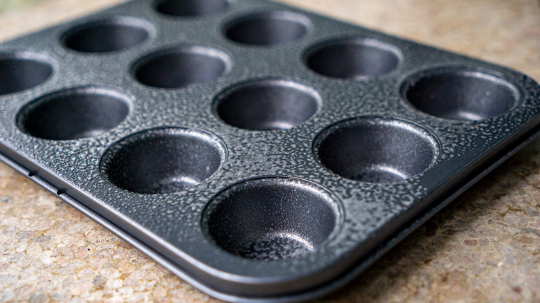 muffin tin with cooking oil
