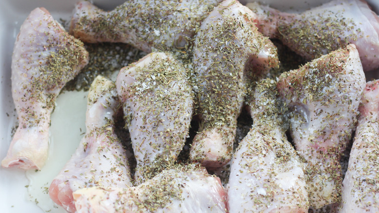 Preparing lemon chicken for baking