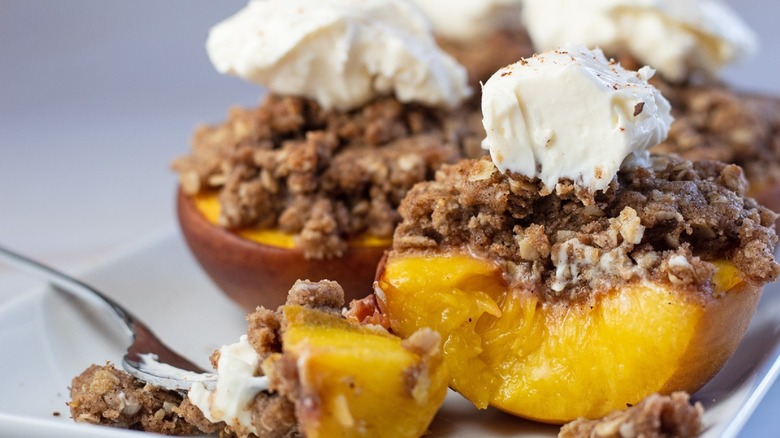 baked peach on white plate