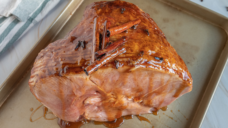 glazed ham with cinnamon sticks