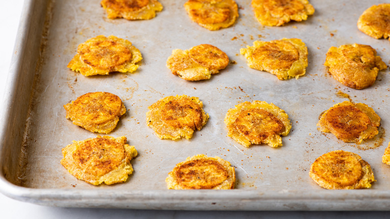 baked tostones on baking sheet