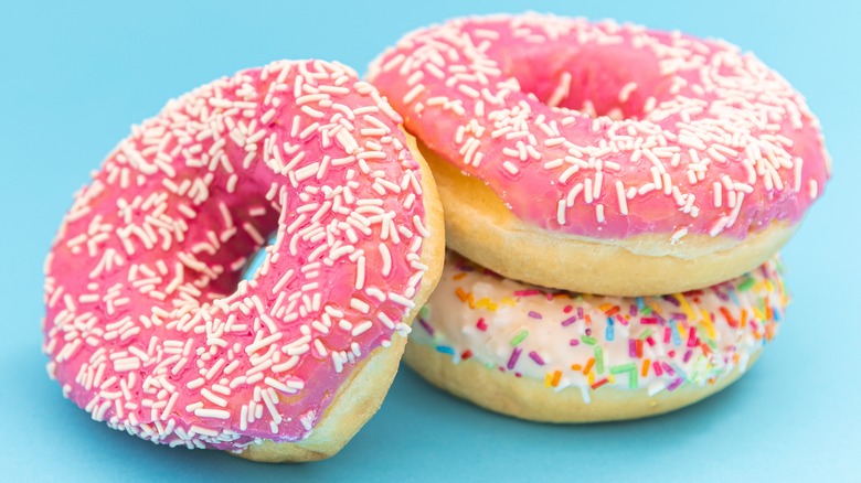 Stack of frosted sprinkle donuts