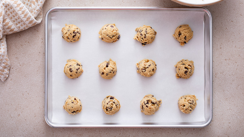 Cookie dough balls on baking sheet