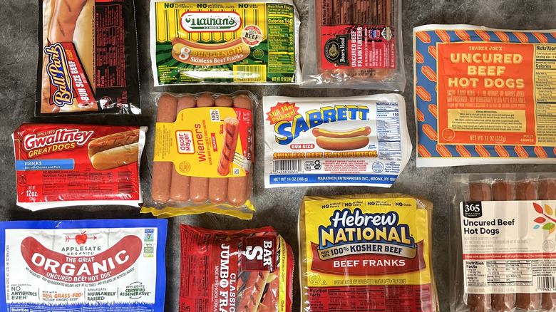 Packages of various brands of hot dogs