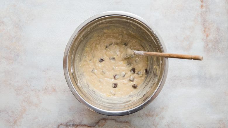 chocolate chunk muffin batter in mixing bowl