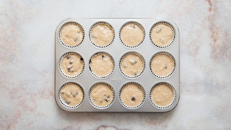 unbaked muffins in muffin tin