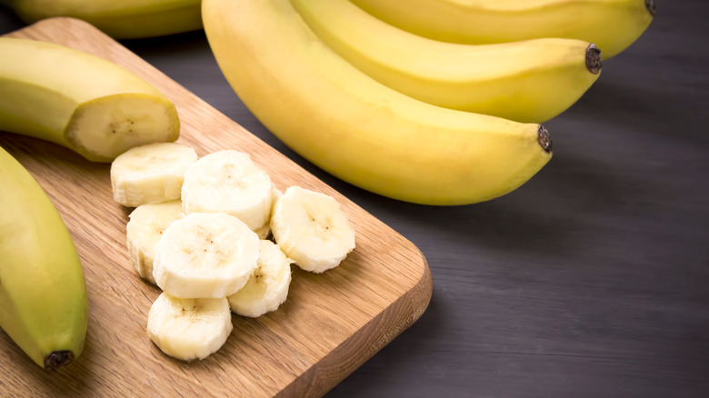 Bananas sliced on a cutting board