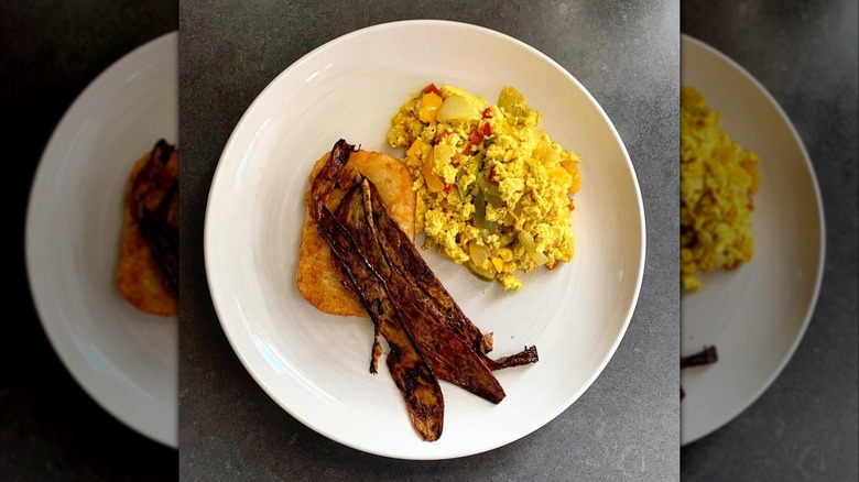 plate of banana peel bacon with hash brown and tofu scramble