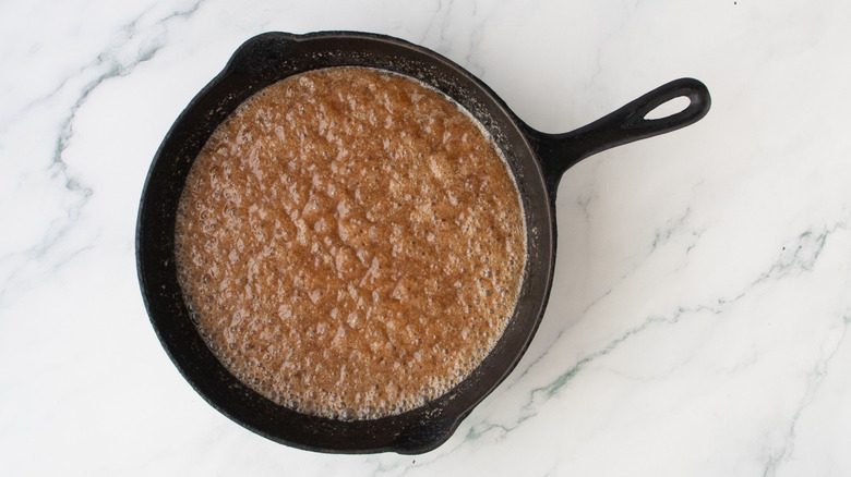 Bubbly caramel sauce in skillet