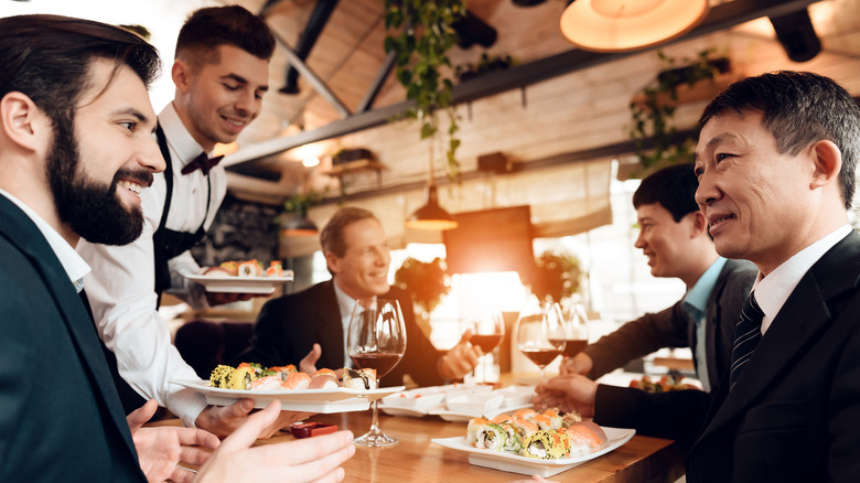 Bankers eating in restaurant