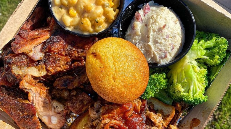 A carry-out box of barbecue and sides from Famous Dave's BBQ