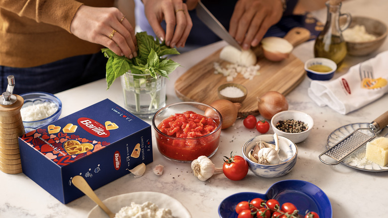 people cooking with Barilla valentine's pasta