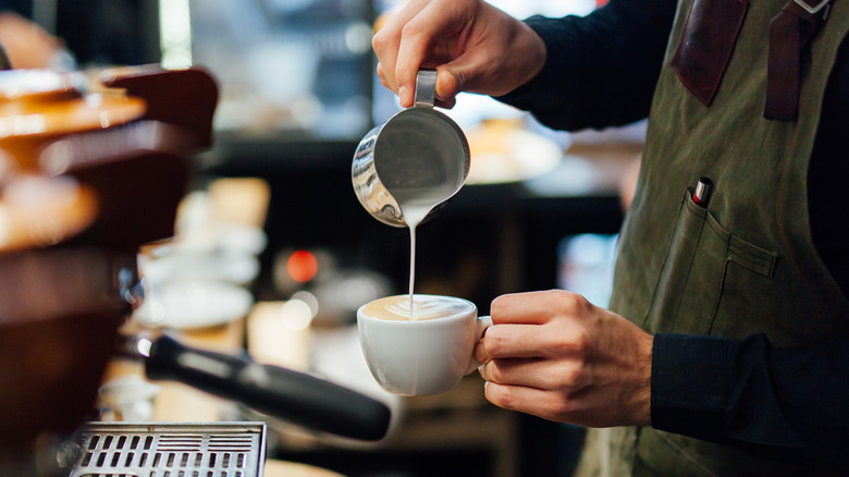 Barista making latte foam art