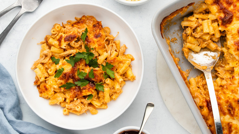 BBQ chicken mac & cheese served from baking dish into bowl