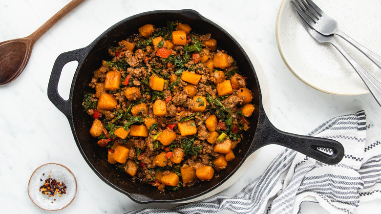 Beef and butternut squash in skillet