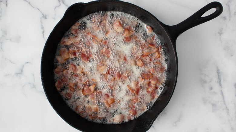 bacon cooking in skillet