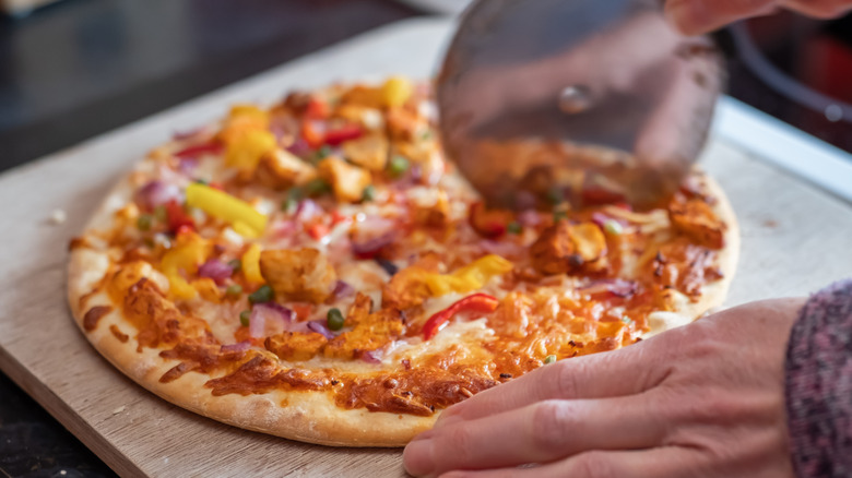 cutting frozen pizza