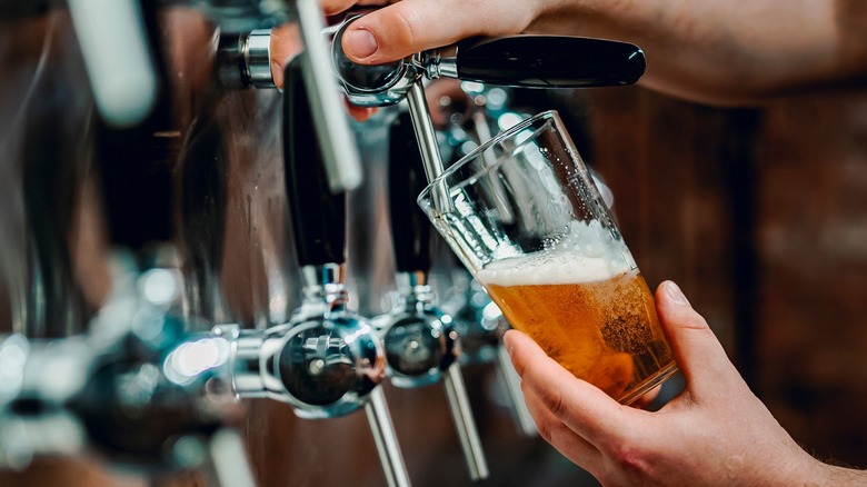 Bartender pouring draft beer