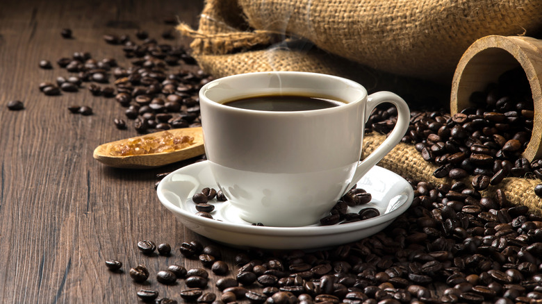Coffee mug with coffee beans