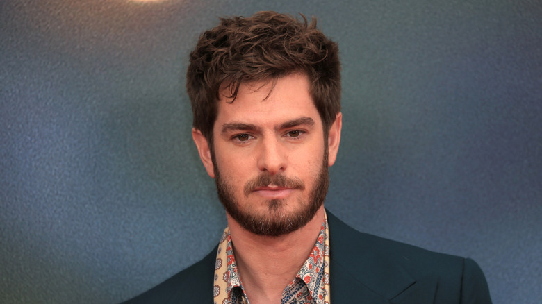 Andrew Garfield wearing a suit and colorful shirt