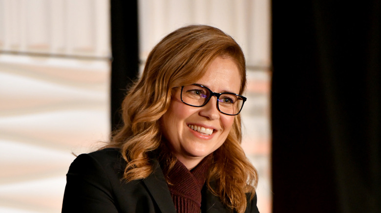 Jenna Fischer wearing glasses and smiling