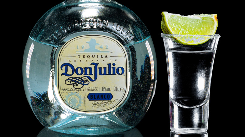 Don Julio 100% agave tequila bottle and a shot with lime